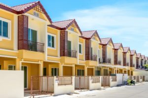 A row of just finished new yellow townhouses