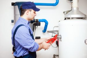 Plumber installing a water heater