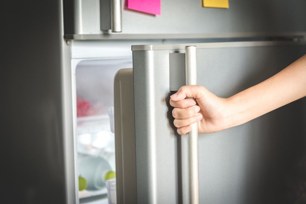 Opening a refrigerator door