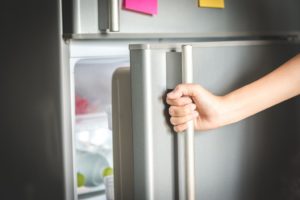 Opening a refrigerator door