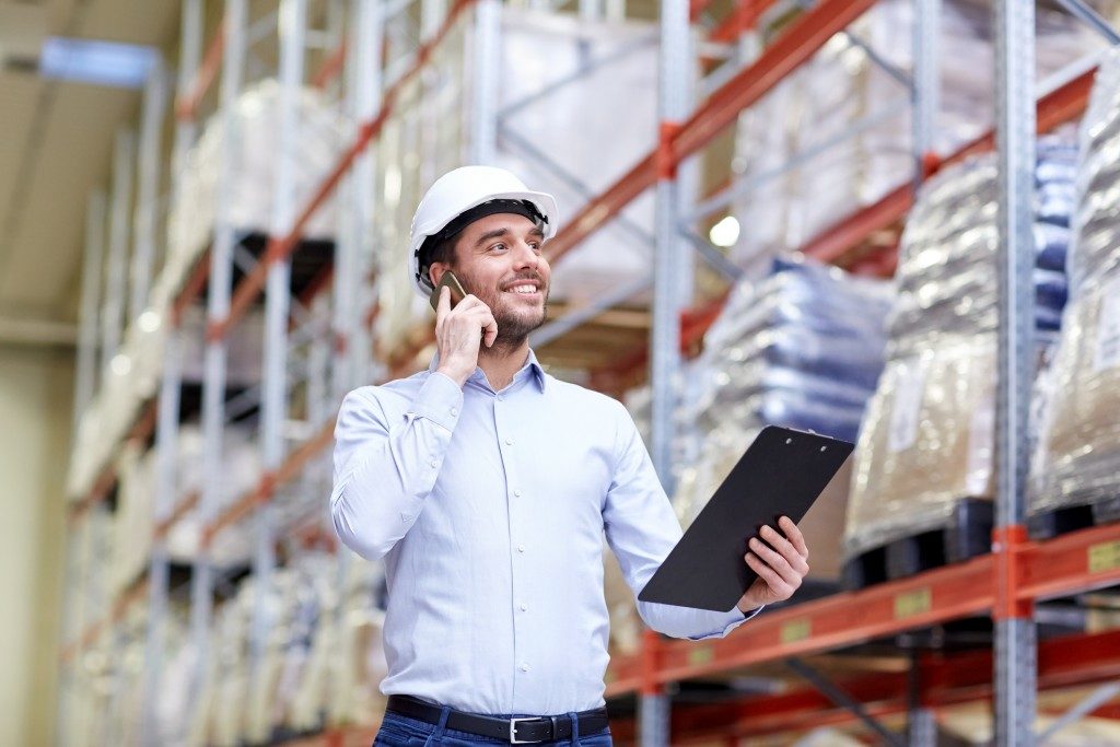 Man in warehouse talking on the phone