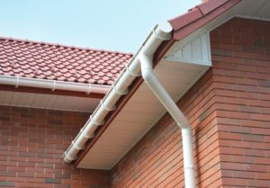 rain gutter and red bricks