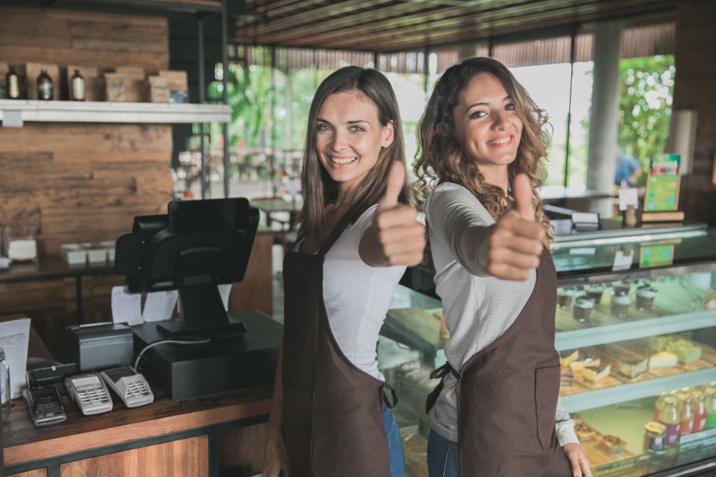 Two female small cafe owners