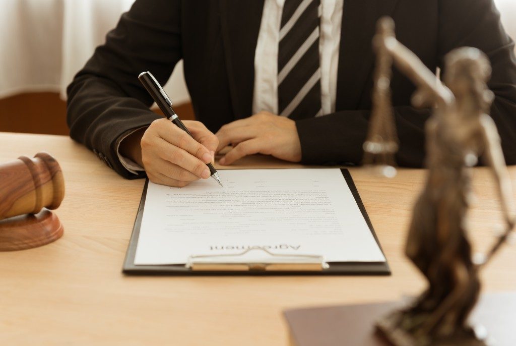 lawyer signing an agreement