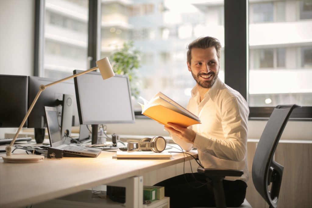 man sitting by his desk