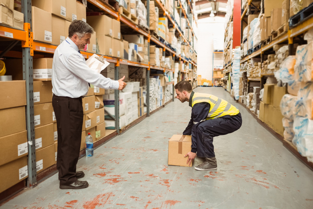 a manager training a new warehouse employee